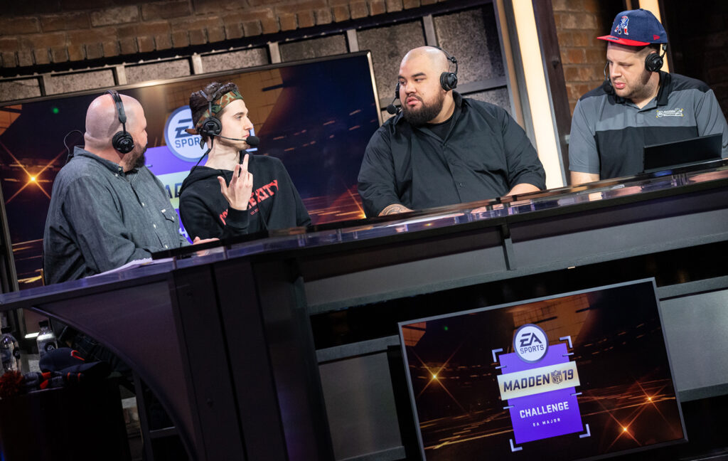 During the Madden NFL 19 Challenge, host/play-by-play caller Scott Cole (far left) analyst/game designer RG (far right) manned the four-person caster desk