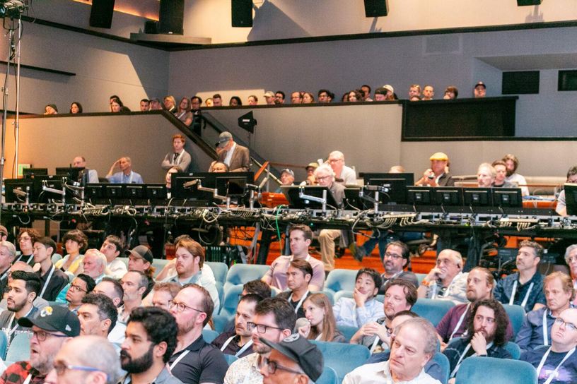 Audio professionals fill a studio theater with a large mixing console during a session at Mix Sound for Film & TV 2026.