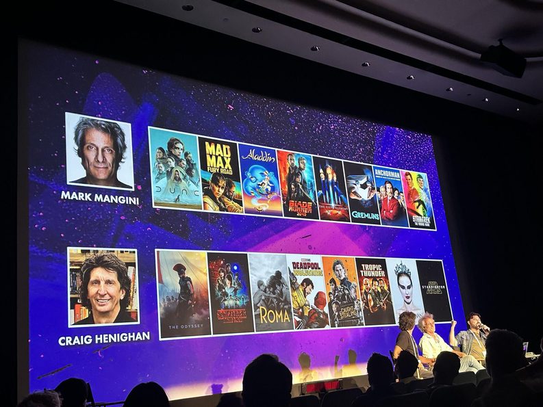 Theater screen showing sound designers Mark Mangini and Craig Henighan with posters of their films during ASG’s INDEPTH LIVE session.