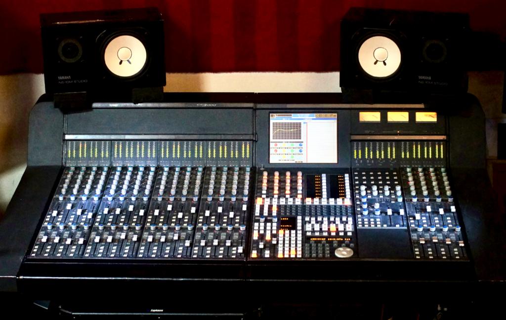 Euphonix CS3000 audio console in a studio with monitor speakers and a central display.